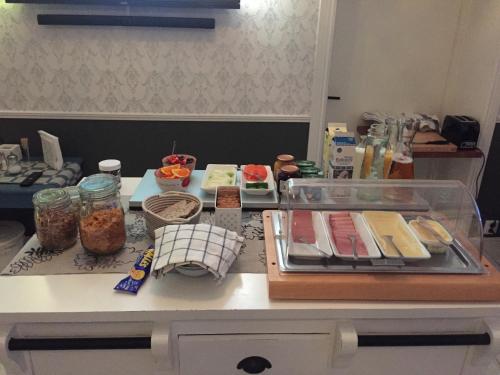 a kitchen counter with some food on a table at Norrfly Herrgård in Kilafors