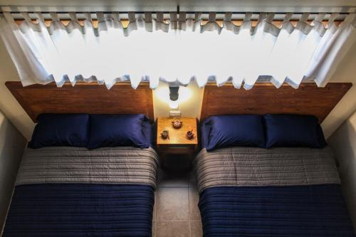 Ein Bett oder Betten in einem Zimmer der Unterkunft Hotel María del Tío Molcas