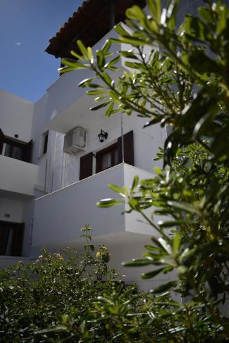 a building with a bee on the side of it at Katerina Studios in Naxos Chora