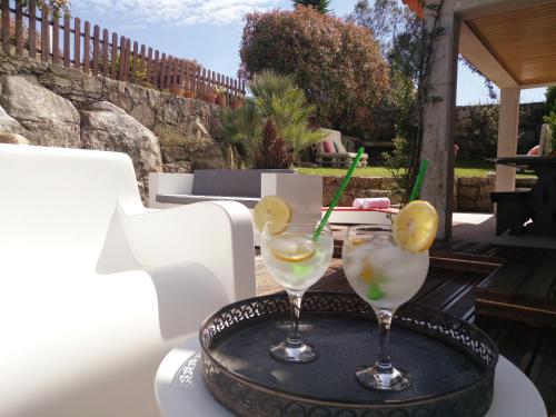 two cocktails sitting on a tray on a table at Casa da Lapa in Aspra