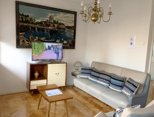 a living room with a couch and a table at Family Espinho Porto Guesthouse in Espinho