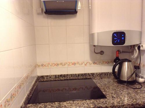 a kitchen with a sink in a counter top at Apartment Estrela Heart in Lisbon
