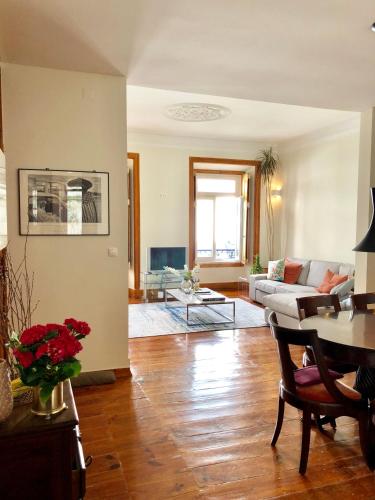 a living room with a couch and a table at Bairro Alto in Lisbon
