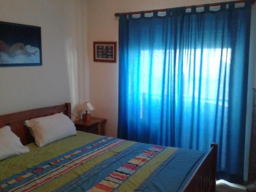 Ένα ή περισσότερα κρεβάτια σε δωμάτιο στο Apartamento Praia da Falésia