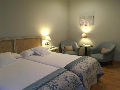Hotel Villa Monter tesisinde bir odada yatak veya yataklar