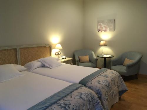 Postel nebo postele na pokoji v ubytování Hotel Villa Monter