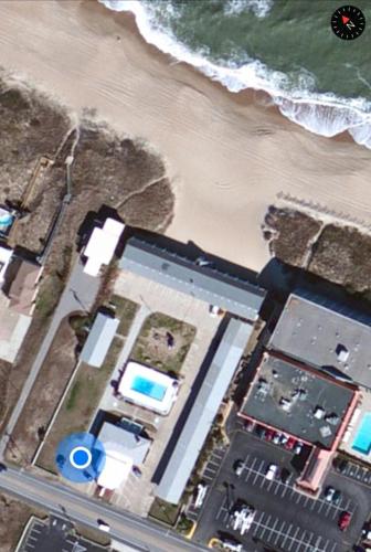 an aerial view of a beach and the ocean at Outer Banks Motor Lodge in Kill Devil Hills
