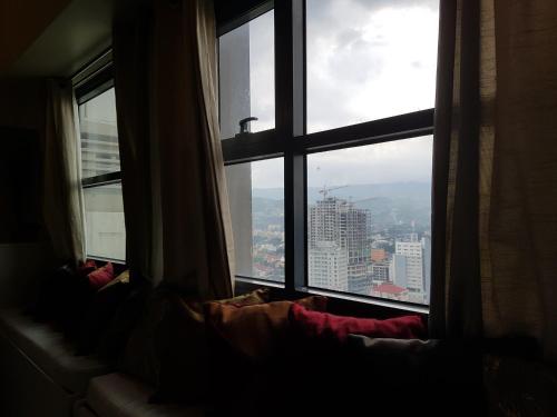 a window with a view of a city at KC Studio 5 at Horizon 101 Cebu in Cebu City