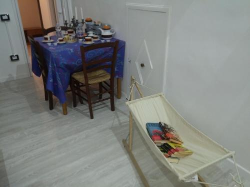 a table with a blue table cloth on it at B&B da Bibi in Fabriano