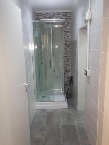 a shower with a glass door in a bathroom at B&B da Bibi in Fabriano