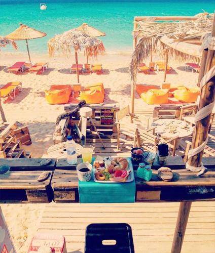 a table with a tray of food on a beach at Filio Guesthouse in Kypri
