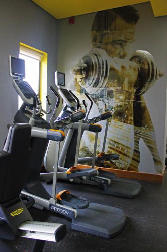 a gym with a painting of a fire hydrant on the wall at Radisson Blu Hotel, Abu Dhabi Yas Island in Abu Dhabi