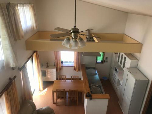 an overhead view of a kitchen with a ceiling fan at Minpaku Momotaro Bekkan in Kasugai