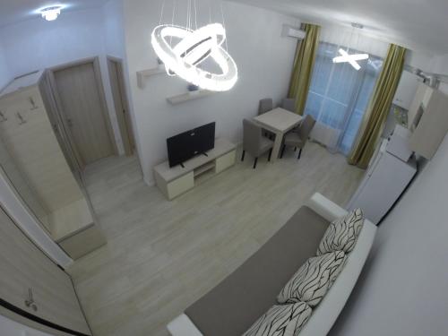 an overhead view of a living room with a couch and a tv at Lotus nr 9 Mamaia Apartments Sea View in Mamaia