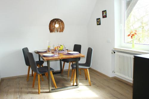 a dining room with a table and chairs at Holiday Home Kötz in Günzburg