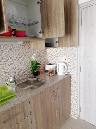 a kitchen with a sink and a counter top at Chicos Studios in Ayia Napa