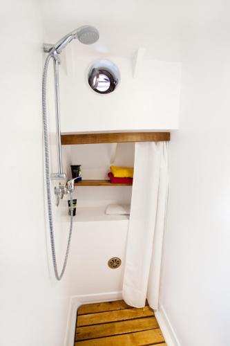 a bathroom with a shower and a sink at Klabauterbett in Bremen