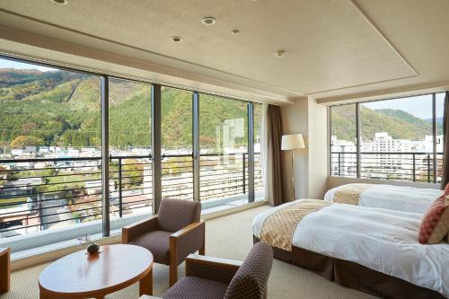 Postel nebo postele na pokoji v ubytování Kinugawa Onsen Sanraku