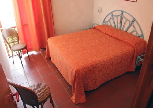 Postel nebo postele na pokoji v ubytování Tanca Manna Grimaldi