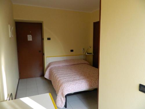 a small bedroom with a bed in a room at Albergo Michieletto in Valmorea