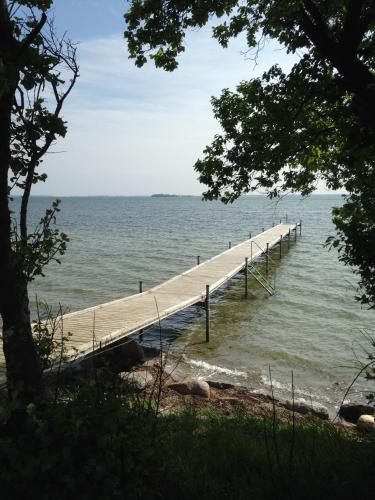 a pier stretches out into the water at Feriecentret Østersø Færgegård in Kalvehave