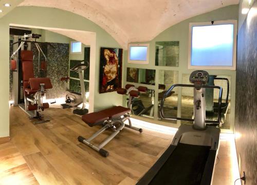 a gym with several exercise equipment in a room at Hotel Il Guercino in Bologna
