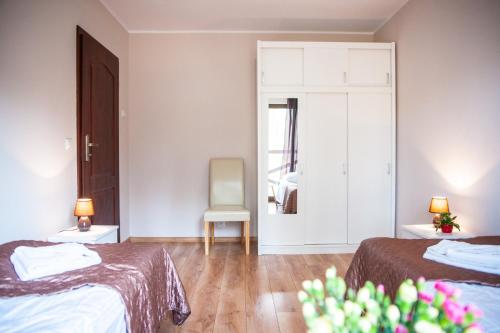 Postel nebo postele na pokoji v ubytování Apartamenty Niegocin