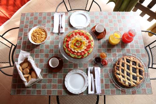 a table with plates and food on top of it at Sogni d'oro in Alberobello