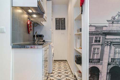 Kuchyňa alebo kuchynka v ubytovaní Cantaria - Checkinhome