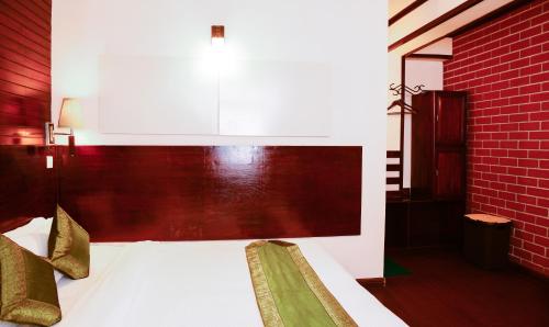 Cama o camas de una habitación en The Nettle and Fern Hotel Gangtok
