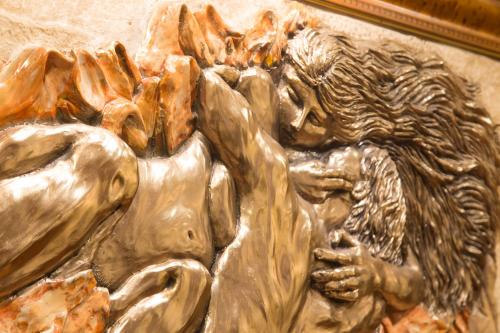 a bronze statue of a man with a horse at Hotel Forte in Rome