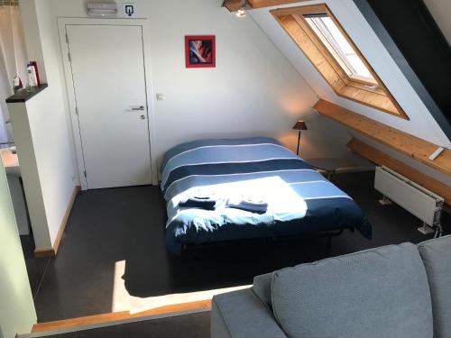 Ένα ή περισσότερα κρεβάτια σε δωμάτιο στο Rap 'n Holiday Home