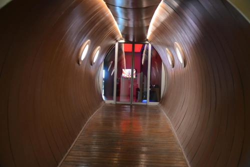 a hallway of a building with wooden walls at Titanic Hotel & SPA in As Sulaymānīyah