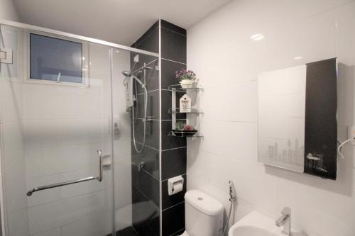a bathroom with a shower and a toilet at H2H - ài home @ Majestic Ipoh in Ipoh