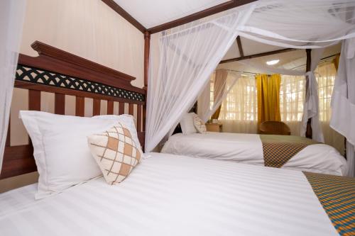 Postel nebo postele na pokoji v ubytování Hotel Rudi