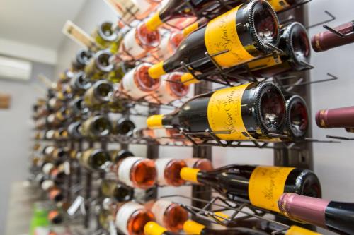a bunch of wine bottles in a rack at Abbaye Sylva Plana in Laurens