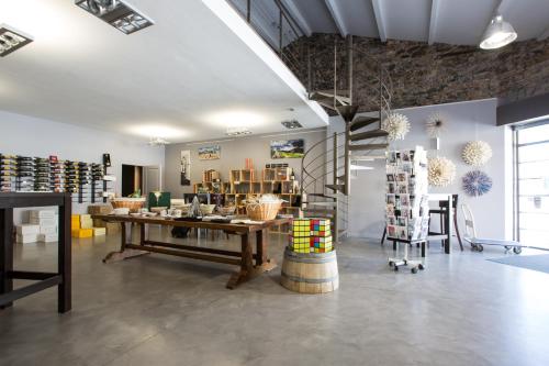 a store with a table and chairs in a room at Abbaye Sylva Plana in Laurens