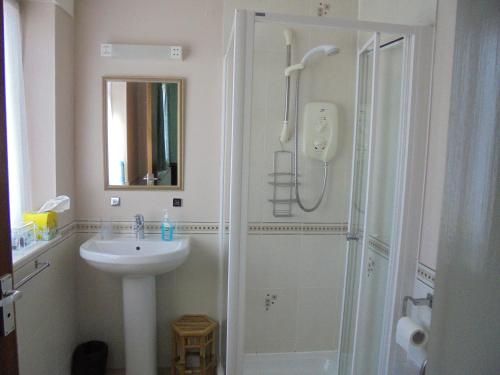 a bathroom with a shower and a sink at Avondale House in Kingussie