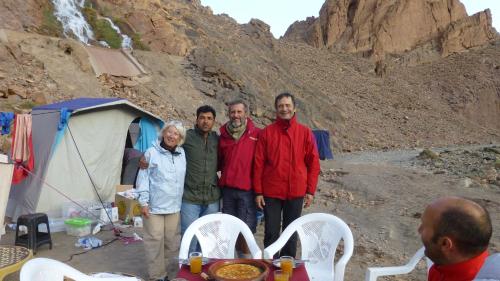 a group of people standing in front of a tent at Auberge Amazigh in Tamtetoucht