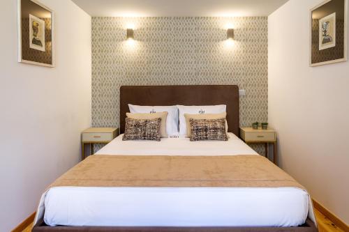 Ένα ή περισσότερα κρεβάτια σε δωμάτιο στο InSitu Formosa 178 by Guestify