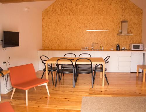 a dining room with a table and chairs at Longroiva Hotel Rural e Termal Spa in Longroiva