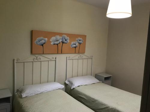 Llit o llits en una habitació de Apartamentos Turísticos La Terraza*
