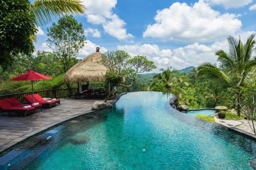 a pool at a resort in the jungle at Adiwana Dara Ayu Villas in Payangan