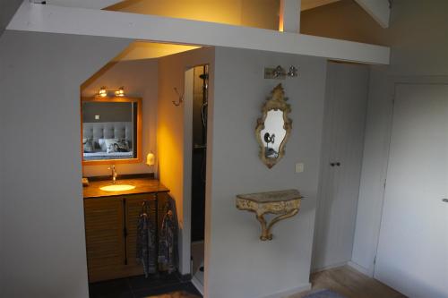 a hallway with a wall with a cow picture on the wall at La Ragotière in Froyennes