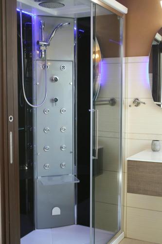 a shower with a glass door in a bathroom at Residence Villa candida in Giardini Naxos