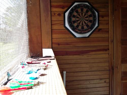 a dart board on the wall of a cabin at Hidden Haven in Unitedville