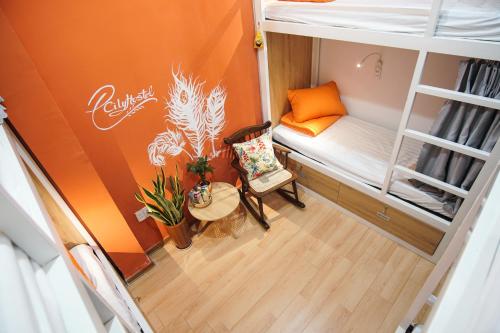 a small room with a bunk bed and a table at City Hostel Da Nang in Da Nang
