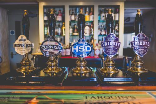 a group of beer awards on a bar at Kings Arms in Penzance