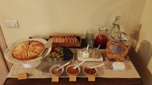 a table with a buffet of food on it at Agriturismo La Romagnana in Pistoia
