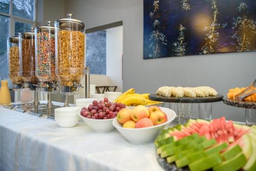 a buffet with fruits and other foods on a table at Wyndham Manta Sail Plaza Hotel and Convention Center in Manta